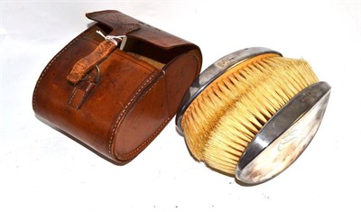 Lot 32 - Two silver brushes in leather case
