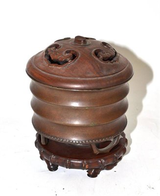 Lot 33 - Japanese bronze vase on bamboo simulated tripod feet, with cover and base