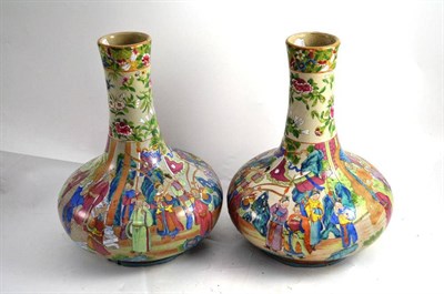 Lot 35 - A pair of polychrome Canton style baluster vases, height 28cm