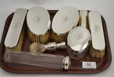 Lot 56 - Eight piece silver mounted toilet set engraved with initials comprising four brushes, toothpick...