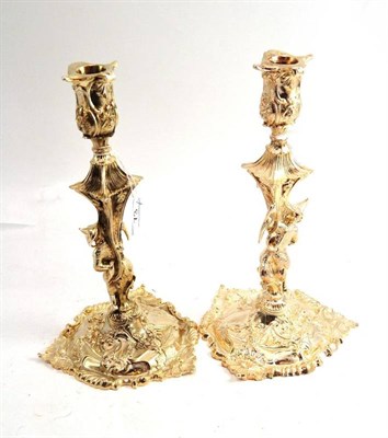 Lot 73 - A pair of George III style silver plated chinoiserie candlesticks