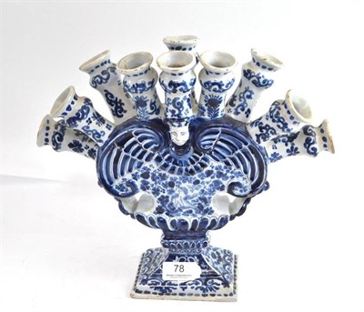 Lot 78 - A Dutch Delft flower holder with ten nozzles issuing from a flattened vase shaped column