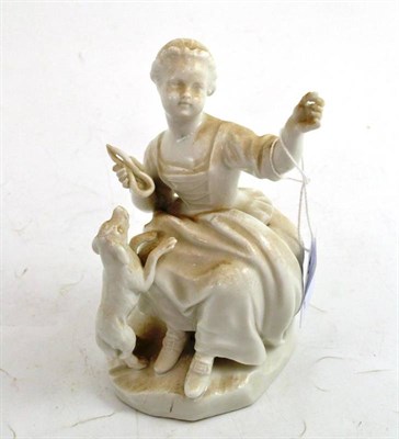 Lot 87 - Porcelain figure of a seated young girl and dog with underglaze blue Vienna beehive mark...