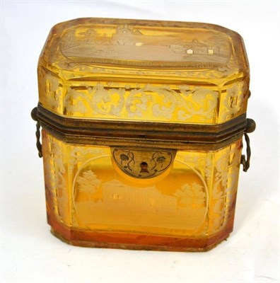 Lot 89 - A Bohemian gilt metal mounted amber overlay glass casket engraved with named buildings, 10cm