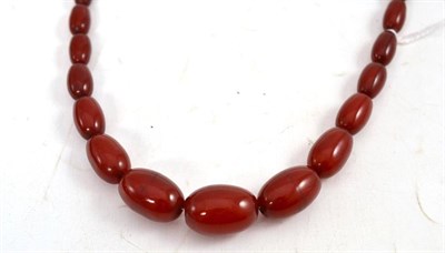 Lot 91 - A cherry amber graduated bead necklace