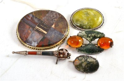 Lot 93 - A Scottish hardstone set dirk brooch and assorted agate brooches