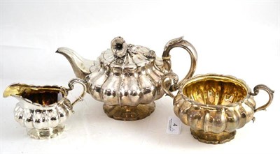 Lot 4 - Three piece Victorian silver melon shaped teapot, sugar and cream