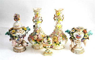 Lot 9 - Pair of floral encrusted vases, pair of vases and covers and a casket and cover