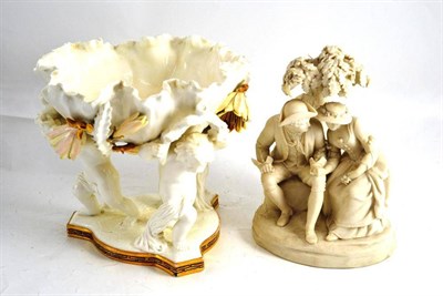 Lot 11 - Parian figure group and a Moore's centrepiece with three putto