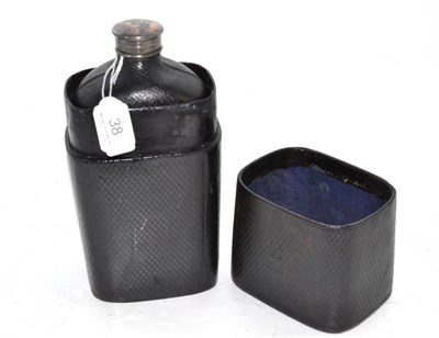 Lot 38 - A large leather cased flask