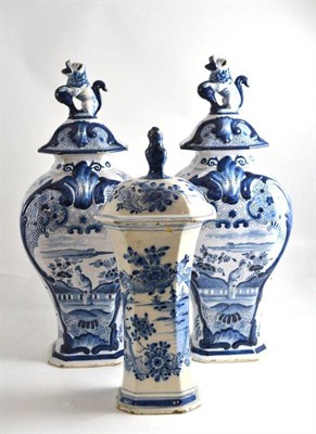 Lot 39 - A pair of Delft vases with lids in the Chinese style and a Delft vase of tapering form