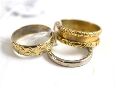 Lot 111 - A 9ct gold patterned band ring, a white band ring and a mourning ring (a.f.)