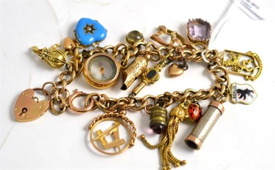 Lot 114 - A charm bracelet hung with seventeen charms
