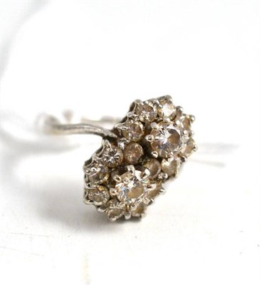 Lot 125 - A diamond double cluster ring, total estimated diamond weight 1.25 carat approx, stamped '18'