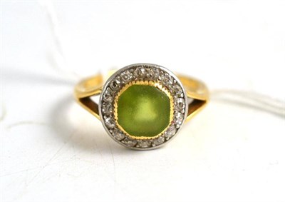 Lot 142 - A peridot and diamond cluster ring