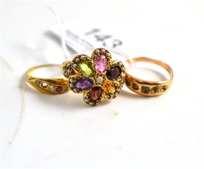 Lot 143 - A 9ct gold multi gem set ring, a ruby and diamond crossover ring (a.f.) and a paste ring