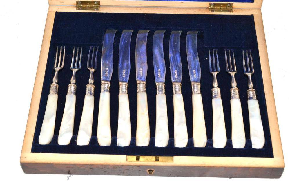 Lot 154 - Set of six silver dessert knives and forks with mother-of-pearl handles