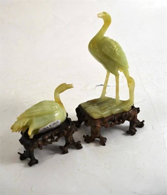 Lot 186 - A pair of green hardstone cranes on wood stands (one a.f.), boxed