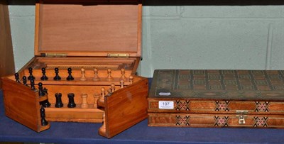 Lot 197 - A North African games board and contents; and a games compendium with chess pieces and cribbage...