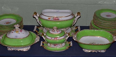 Lot 198 - A 19th century porcelain dinner service with painted floral sprays and green border