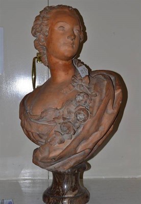 Lot 216 - After Clodion: a terracotta bust of a pretty young woman, French, 19th century, with curled and...