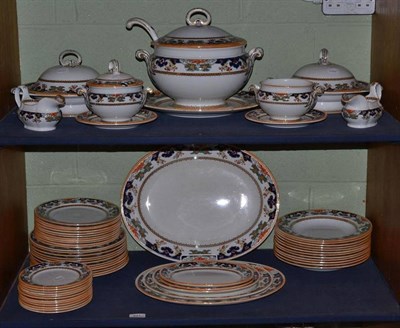 Lot 221 - A Mintons dinner service with floral and orange lustre border