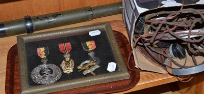 Lot 232 - A group of three miniature war medals, three badges, a Bell & Howell telescope sight and five pairs