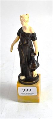 Lot 233 - A patinated bronze and ivory figure, by Hans Keck, modelled as a classical maiden carrying a...