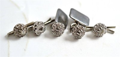 Lot 255 - A pair of diamond cluster cufflinks and three buttons