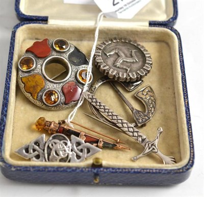 Lot 277 - Scottish hardstone dirk brooch and five other brooches