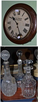 Lot 293 - Oak cased wall clock FWD Hodgson, Northallerton and three glass decanters