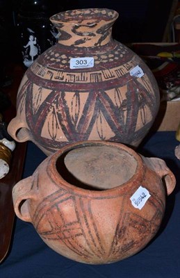 Lot 303 - A Chinese terracotta twin handled jar of Machang type, 30cm; and a similar smaller jar