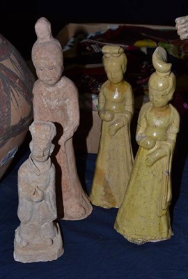 Lot 304 - A Chinese terracotta figure of a maiden, in Tang style, 26cm high; two yellow glazed figures,...