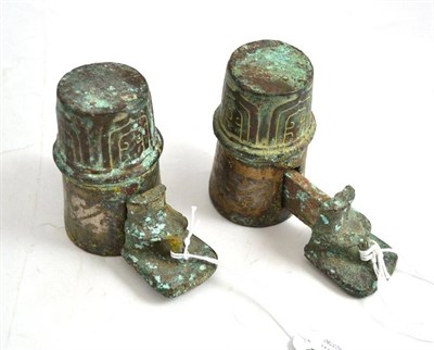 Lot 311 - A pair of Chinese bronze axel fittings, possibly East Zhou Dynasty, with stiff leaf moulded...