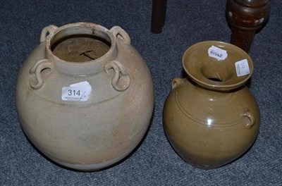 Lot 314 - A Chinese porcellaneous stoneware ovoid jar, possibly Tang, 26cm high; and another celadon...