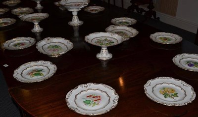 Lot 315 - A 19th century gilt highlighted porcelain dessert service painted with flowers