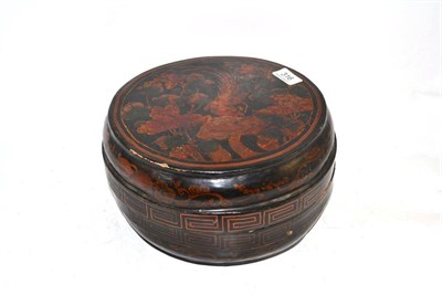 Lot 316 - A Chinese lacquer circular box and cover decorated with birds in branches, 28cm