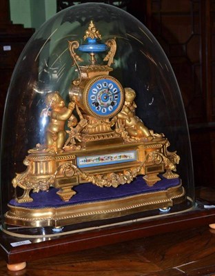 Lot 345 - A gilt metal and porcelain mounted striking mantel clock, circa 1880, urn finial, flanked by winged