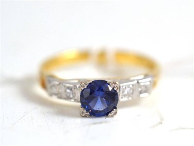 Lot 358 - An 18ct gold sapphire and diamond ring