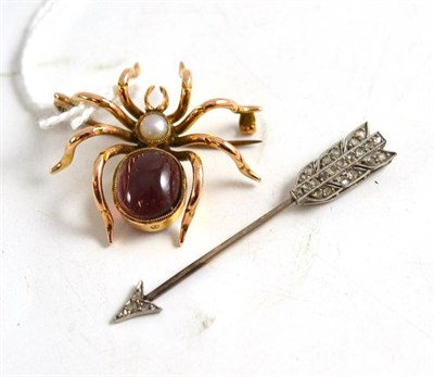 Lot 384 - A spider brooch with cabochon garnet and split pearl body, and a diamond set arrow pin (2)