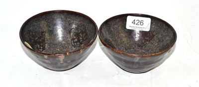 Lot 426 - Two Chinese leaf decorated black glazed tea bowls