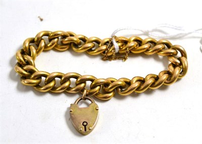 Lot 5 - A curb bracelet, stamped '15CT', hung with padlock