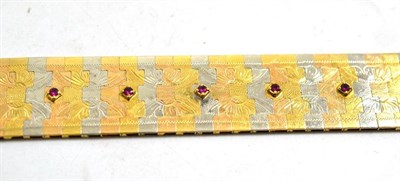 Lot 8 - A three colour bracelet set with rubies, stamped '750', length 19cm, width 2cm
