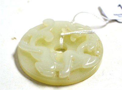 Lot 13 - A Chinese carved jade disk