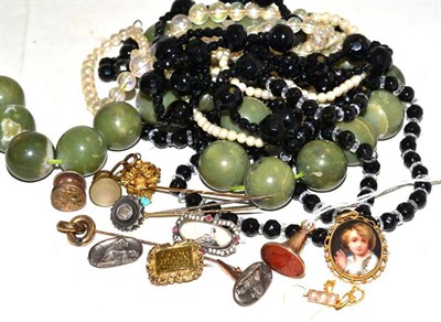Lot 20 - A cornelian intaglio seal fob, a portrait brooch, a pearl set necklace clasp, four assorted...