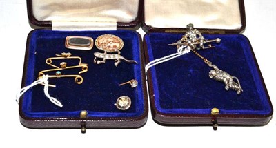 Lot 22 - A paste set ape brooch with second ape suspended; and eight other brooches and pins, including...