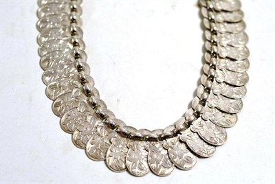 Lot 23 - An unmarked white metal floral panel necklace, 43.5cm long