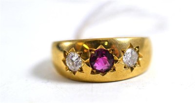 Lot 25 - A 9ct gold ruby and diamond three stone ring, total estimated diamond weight 0.35 carat...