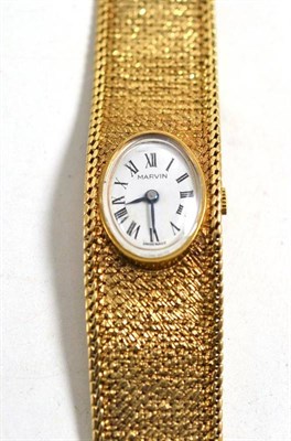 Lot 36 - A lady's 9ct gold wristwatch, signed Marvin, 1968, 19mm wide, with a Marvin box