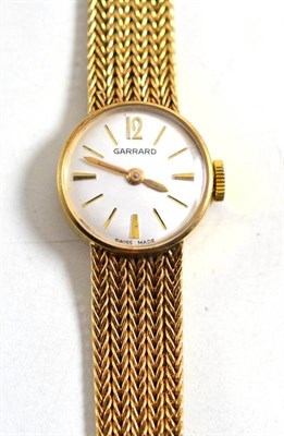 Lot 67 - A lady's 9ct gold wristwatch, signed Garrard, 1972, 17mm wide
